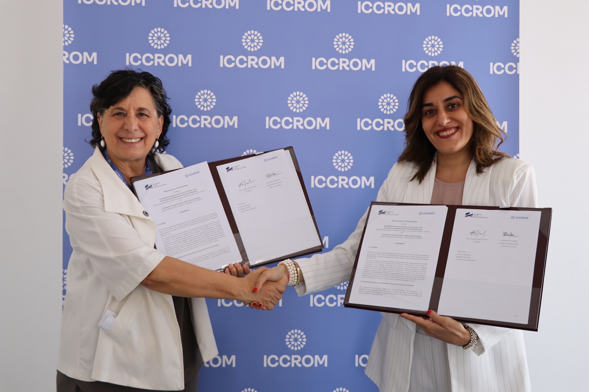 A. Vittornin and A. Gujral signing an MoU